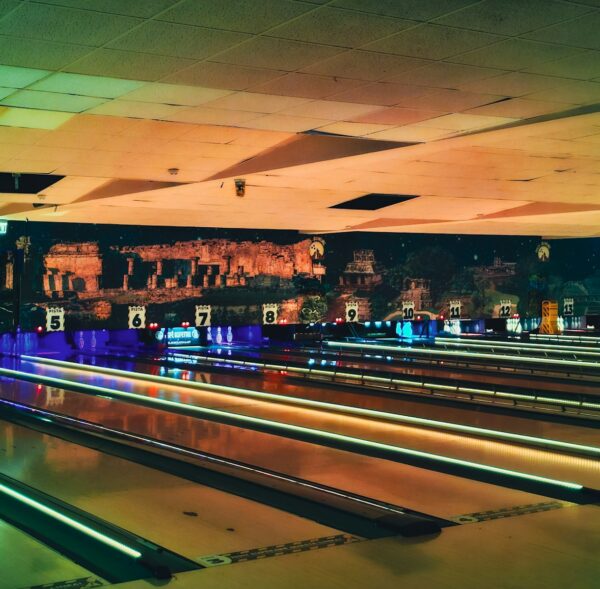 a bowling alley filled with bowling pins at night